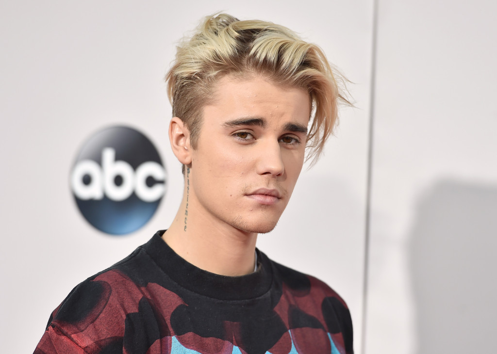 FILE - In this Sunday, Nov. 22, 2015 file photo, Justin Bieber arrives at the American Music Awards at the Microsoft Theater in Los Angeles. With his recent batch of hit singles and semi-grown-up sound - including the electro-pop "Where Are U Now" with DJ-producers Skrillex and Diplo - adult men have begun attending the church of Bieber, and while some have issues admitting it, other proudly say they are Beliebers. Sorry and What Do You Mean, currently at Nos. 2 and 4 on Billboards Hot 100 chart, helped Bieber solidify his comeback after years of a broken image, which included arrests, public smoking and fainting onstage that led to hospitalization. (Photo by Jordan Strauss/Invision/AP, File)