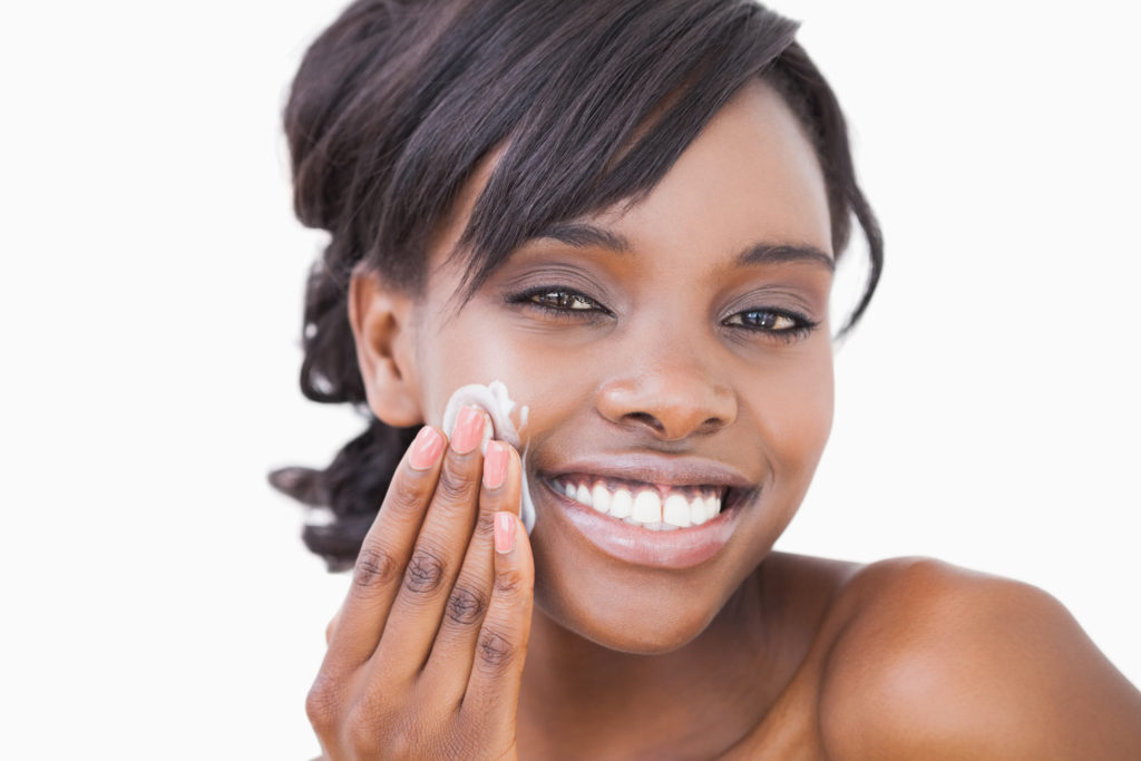 Woman using skin cream